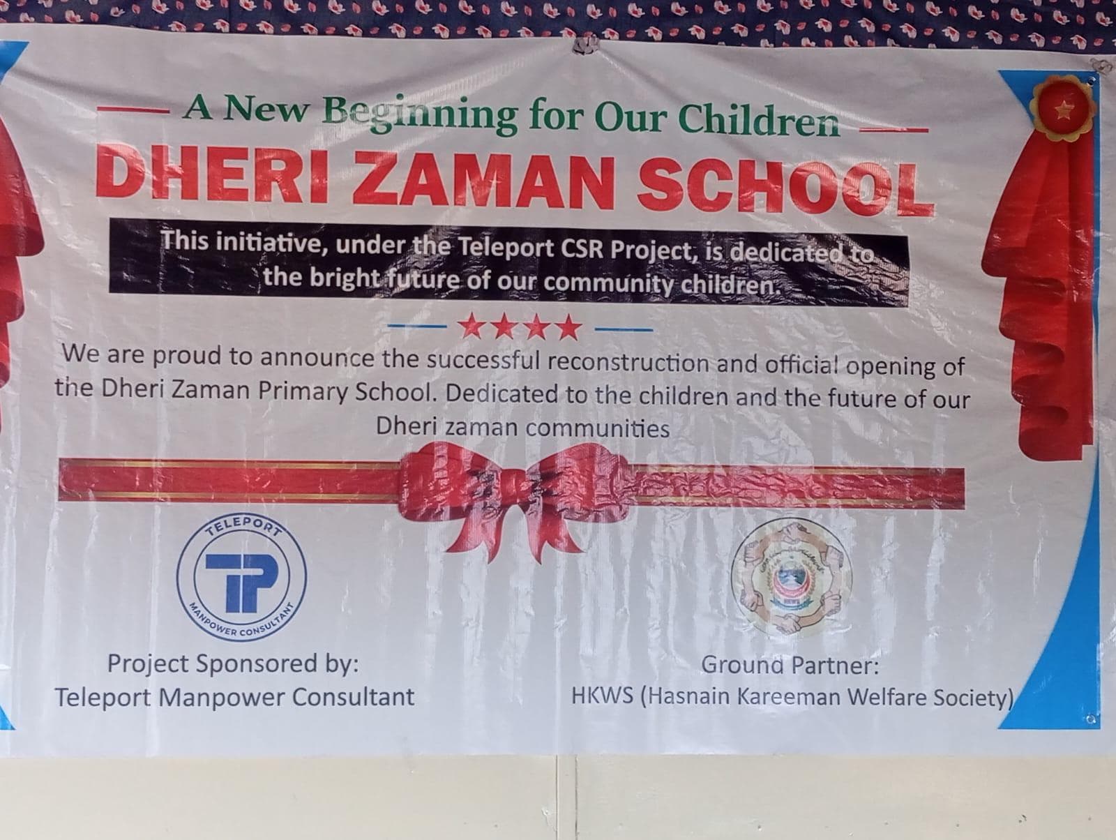 Students and teachers outside the rebuilt Dheri Zaman Primary School